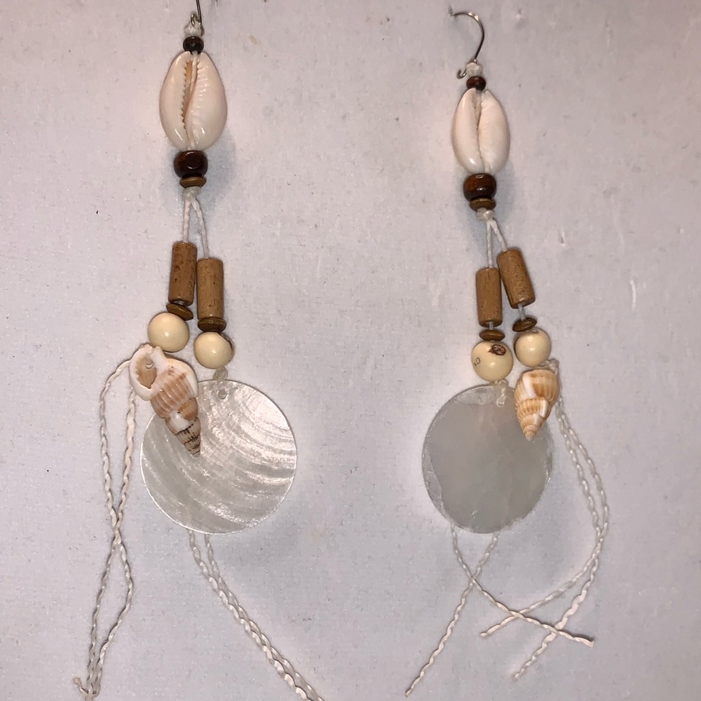 Cowry shell, mother-of-pearl, and seeds earrings.